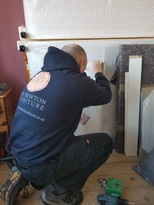 Roy fitting a bedroom in Cannock.
