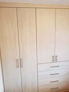 Wardrobe with four drawer linen press.