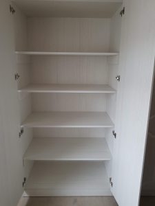 Shelved cupboard showing full carcass system.