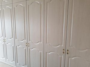Hacienda white fitted wardrobes.