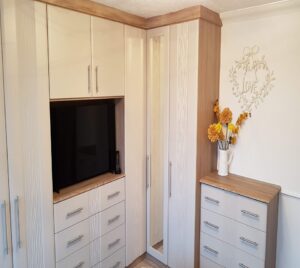 A bedroom in matt cashmere and sahara doors with oak framework and interior. With t bar handles.